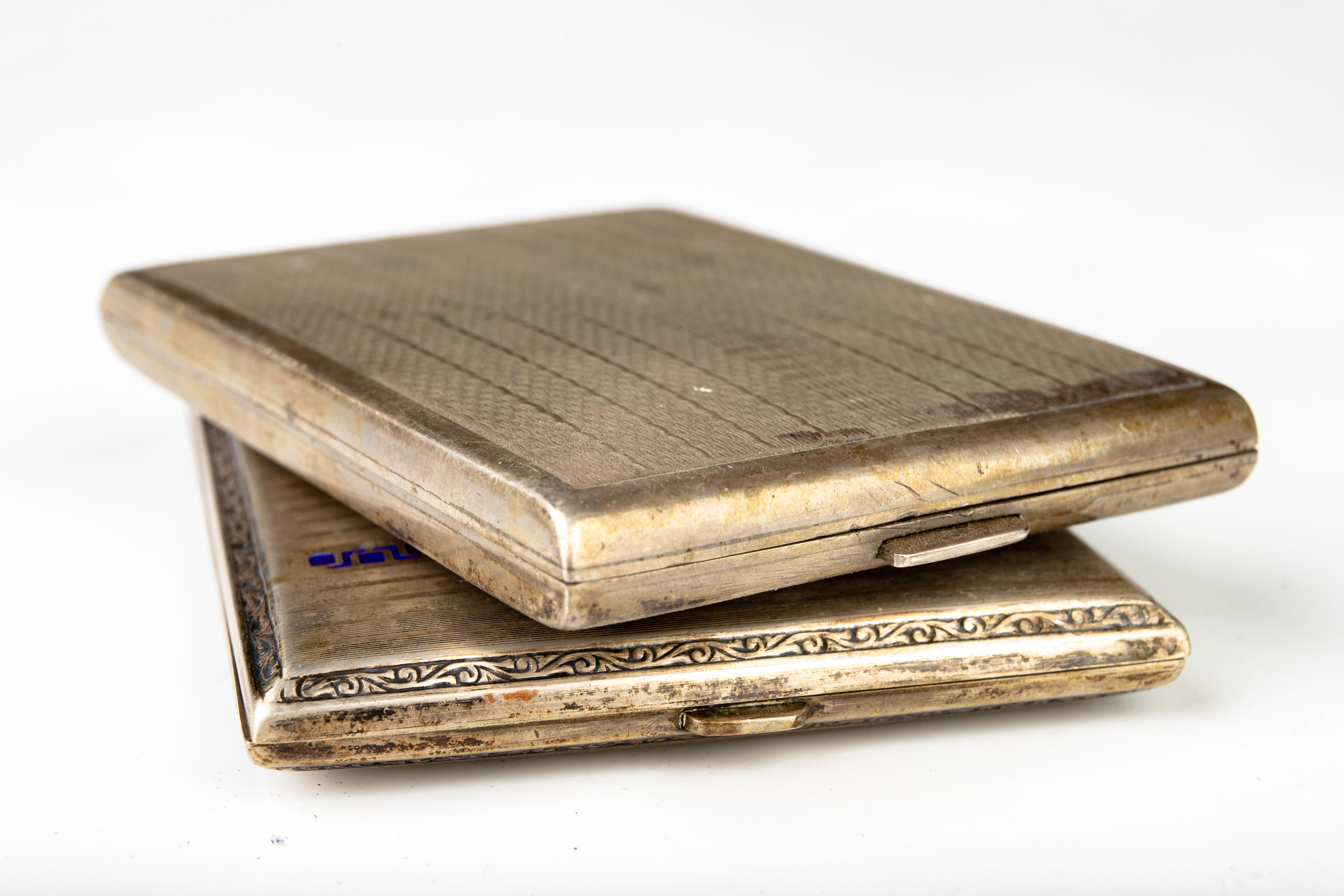 Silver cigarette cases — engine-turned and engraved sterling