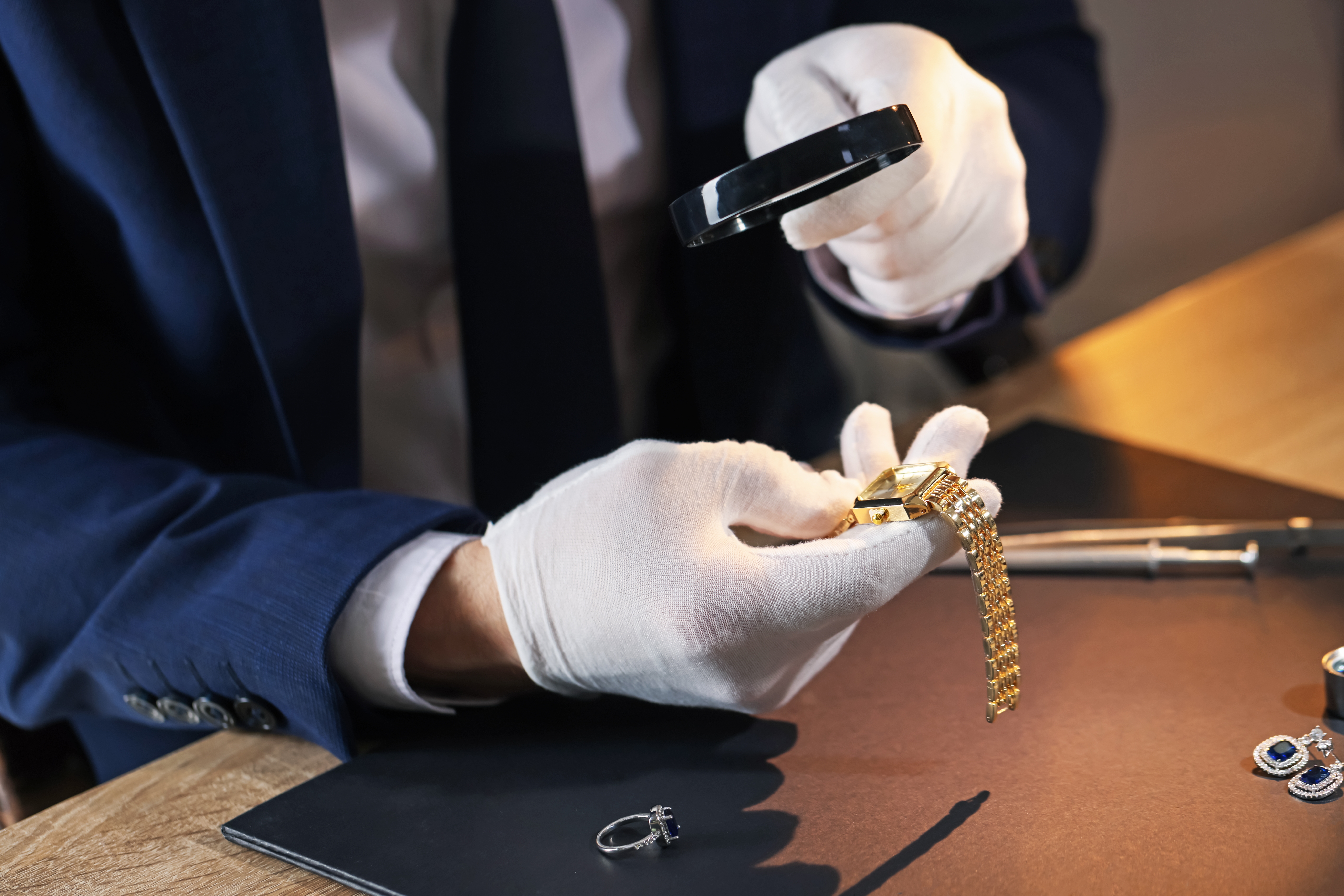 Gold chains being weighed on a calibrated digital scale